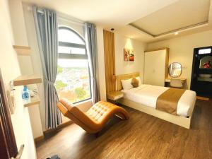 Postel nebo postele na pokoji v ubytování Torino Hotel Dalat