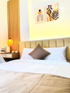 Postel nebo postele na pokoji v ubytování Torino Hotel Dalat