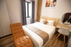 Postel nebo postele na pokoji v ubytování Torino Hotel Dalat