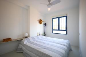 Łóżko lub łóżka w pokoju w obiekcie Campoamor Seaview