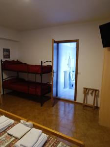 Ein Etagenbett oder Etagenbetten in einem Zimmer der Unterkunft Albergo San Giorgio
