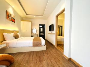 Postel nebo postele na pokoji v ubytování Torino Hotel Dalat