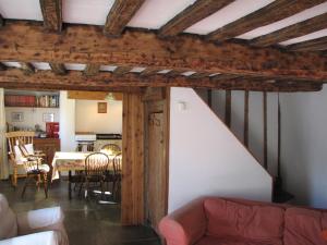a living room with a couch and a table at The Old Farmhouse in Crackington Haven