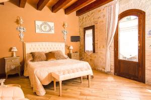 a bedroom with a bed and a window and a door at Garden Cactus in Villaggio Mosè