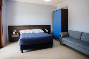 Postel nebo postele na pokoji v ubytování B&B Torre Talao