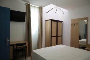 Postel nebo postele na pokoji v ubytování Casa Dalmazia