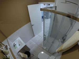 a bathroom with a shower with a glass door at Casa Huidobro Valle in Sardón de los Frailes +25 photos