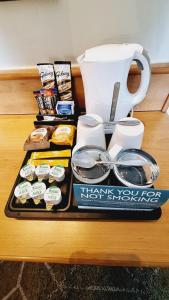a tray of food and a coffee pot on a table at The Brocket Arms Wetherspoon in Wigan
