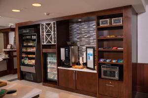 a coffee shop with a vending machine and a refrigerator at Hilton Garden Inn Erie in Erie