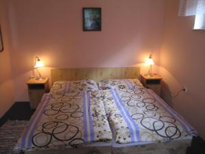 A bed or beds in a room at Privát Magdalena