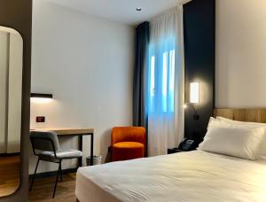Postel nebo postele na pokoji v ubytování Hotel Leonessa