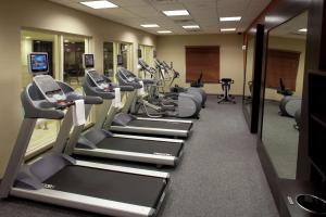 a gym with treadmills and elliptical machines at Hilton Garden Inn Sioux Falls South in Sioux Falls
