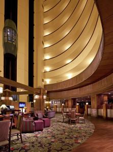 a lobby of a hotel with chairs and tables at The Park Vista - A DoubleTree by Hilton Hotel - Gatlinburg in Gatlinburg