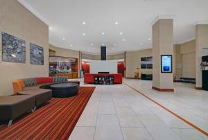 a large lobby with a couch and a screen at DoubleTree by Hilton Grand Junction in Grand Junction