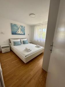 Katil atau katil-katil dalam bilik di Apartments VINSE near Rab center +161 gambar