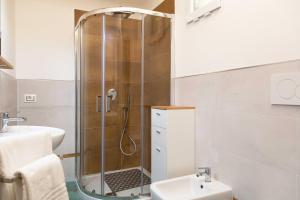 a bathroom with a shower and a sink at Dimora La Fiumara in Marina di Grosseto