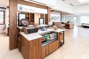 a store with a drink counter in the shop at Hilton Garden Inn Fairfax in Fairfax