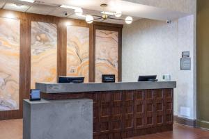 a lobby with a large painting on the wall at Homewood Suites by Hilton Indianapolis Downtown in Indianapolis