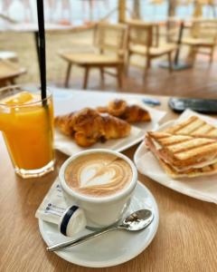 a cup of coffee and pastries on a table at HAVANA HOUSE in Sakës