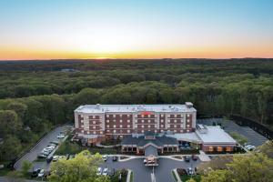 an aerial view of a hotel with a parking lot at Hilton Garden Inn Stony Brook in Stony Brook