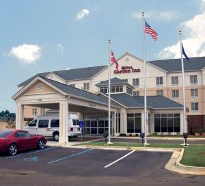 a hotel with a car parked in a parking lot at Hilton Garden Inn Jackson/Pearl in Pearl