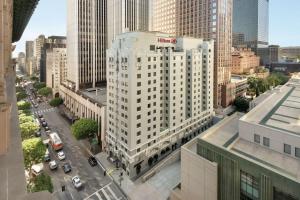an aerial view of a tall white building in a city at Hilton Checkers Los Angeles in Los Angeles