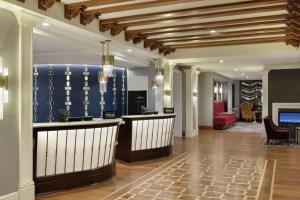 a lobby with a bar and a living room at Hilton Checkers Los Angeles in Los Angeles