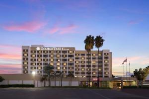 a rendering of the doolin hotel at dusk at DoubleTree by Hilton Los Angeles Norwalk in Norwalk