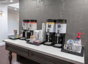 a counter with several coffee machines on it at Hampton Inn and Suites Lafayette in Lafayette