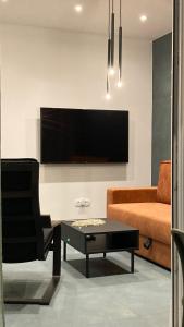 Televízia a/alebo spoločenská miestnosť v ubytovaní Apartment Tomic Krk