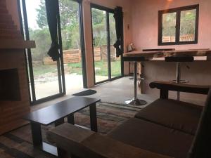 a living room with a couch and a table at Quinta Lum in San Cristóbal de Las Casas