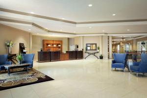 a lobby with blue chairs and a waiting room at DoubleTree Resort by Hilton Lancaster in Lancaster