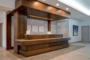 a lobby with a reception desk in a building at Hilton Garden Inn Kansas City/Kansas in Kansas City