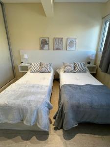 Ένα ή περισσότερα κρεβάτια σε δωμάτιο στο Departamento Azcuénaga Sur