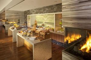 a kitchen with a fireplace in a restaurant at Hilton McLean Tysons Corner in Tysons Corner