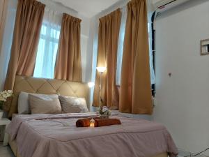 Ένα ή περισσότερα κρεβάτια σε δωμάτιο στο Amir Homestay Bangi @ Seri Putra