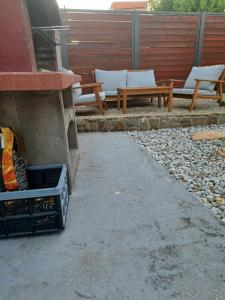 a patio with two picnic tables and two benches at Kvarner holiday home in Jadranovo +23 photos