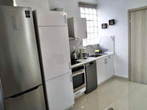 Kuchyň nebo kuchyňský kout v ubytování Zoe Boutique Suite