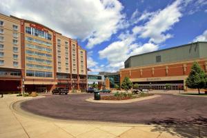 a building with a circle in the middle of a street at Hilton Garden Inn Mankato Downtown in Mankato