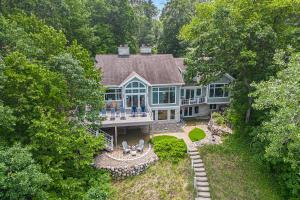 an aerial view of a large house with a porch at Beachside in Harbert