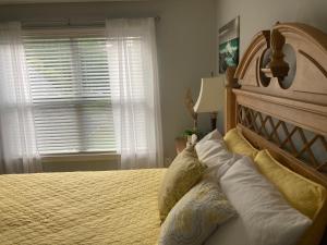 a bedroom with a large bed and a window at Casa Cool in Braselton