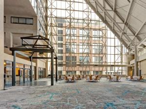a large lobby with chairs and a large building at DoubleTree by Hilton St Paul Downtown in Saint Paul