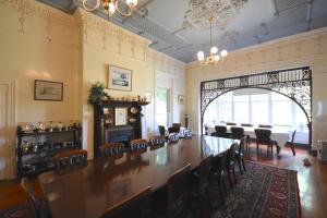 a large dining room with a long table and chairs at Kilmany Park Estate in Sale