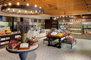 a bakery with many different types of food on display at Hilton Club New York in New York