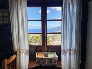 a large window with a view of the ocean at Estudio Rural de Piedra in Frontera