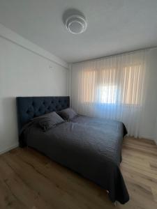 Ένα ή περισσότερα κρεβάτια σε δωμάτιο στο Icon Apartment