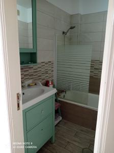 a bathroom with a sink and a shower at Tenerife Sweet Home, Cheap and Clean, Pool, Beach, WiFi, Quite in Los Cristianos