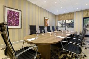 a conference room with a long table and chairs at DoubleTree by Hilton Orlando East - UCF Area in Orlando +19 photos