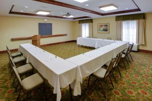 a conference room with a long table and chairs at Hampton Inn Auburn in Auburn