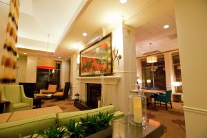 a living room with a couch and a fireplace at Hilton Garden Inn Oxnard/Camarillo in Oxnard